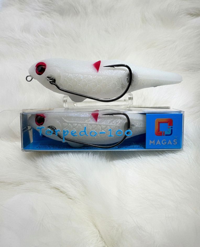 Toman giant snakehead caught with MAGAS Torpedo-100 Pencil Lure soft silicone anti-snag fishing lure near heavy cover, weeds, and shallow structure.