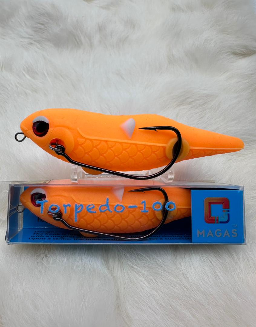 Toman giant snakehead caught with MAGAS Torpedo-100 Pencil Lure soft silicone anti-snag fishing lure near heavy cover, weeds, and shallow structure.