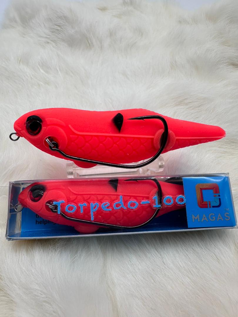 Toman giant snakehead caught with MAGAS Torpedo-100 Pencil Lure soft silicone anti-snag fishing lure near heavy cover, weeds, and shallow structure.