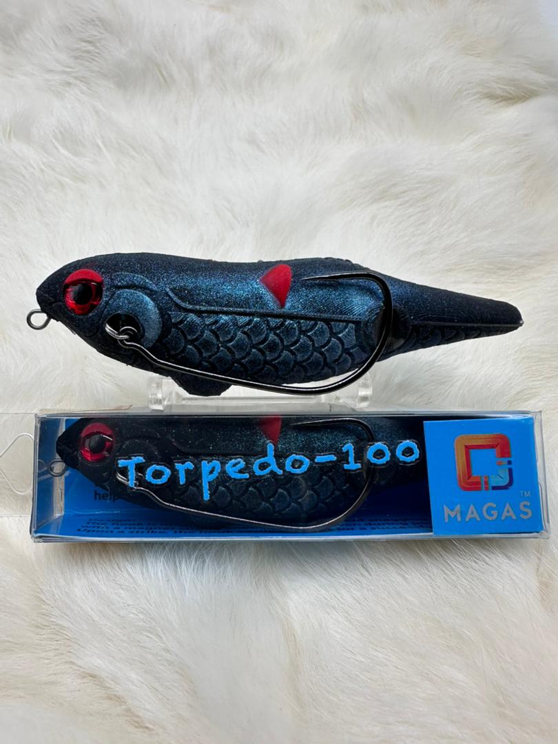 Toman giant snakehead caught with MAGAS Torpedo-100 Pencil Lure soft silicone anti-snag fishing lure near heavy cover, weeds, and shallow structure.